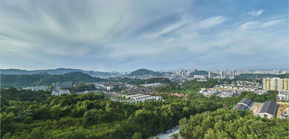Kuala Lumpur skyline and green Taman Melawati surroundings